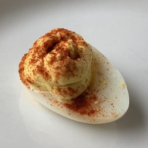 Deviled or dressed egg on a plate