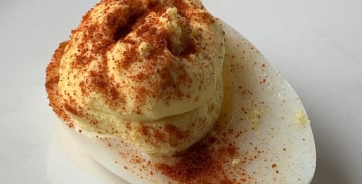 Deviled or dressed egg on a plate