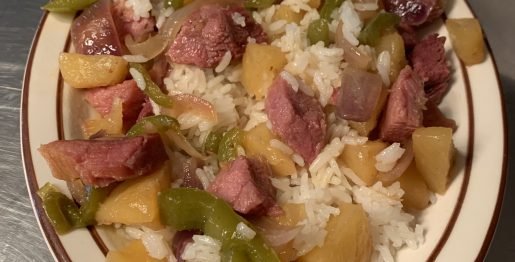 Plated pineapples and ham on rice
